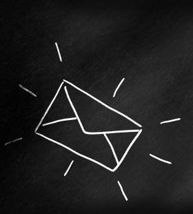 White outline drawing of a mailing envelope on a black background.