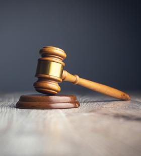 Gavel on table.